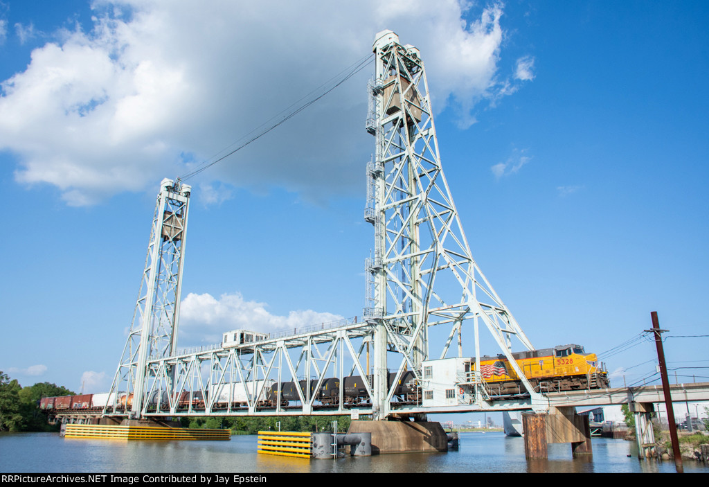 A westbound UP train crosses the Neches River Lift Bridge